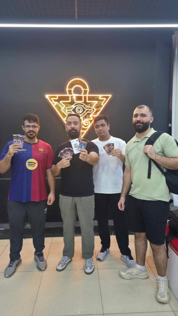 Players with their packs under the neon sign at Dark Side